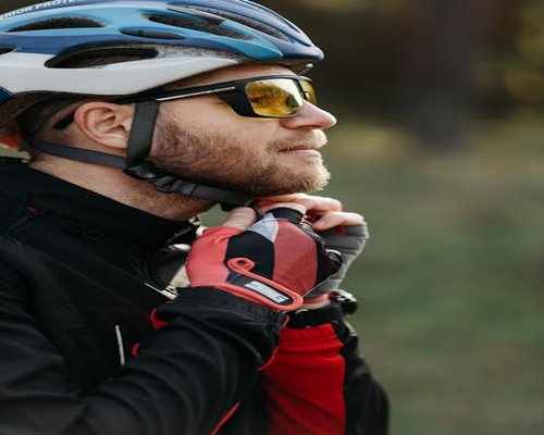Cyclist riding outdoors with proper sunlight gear